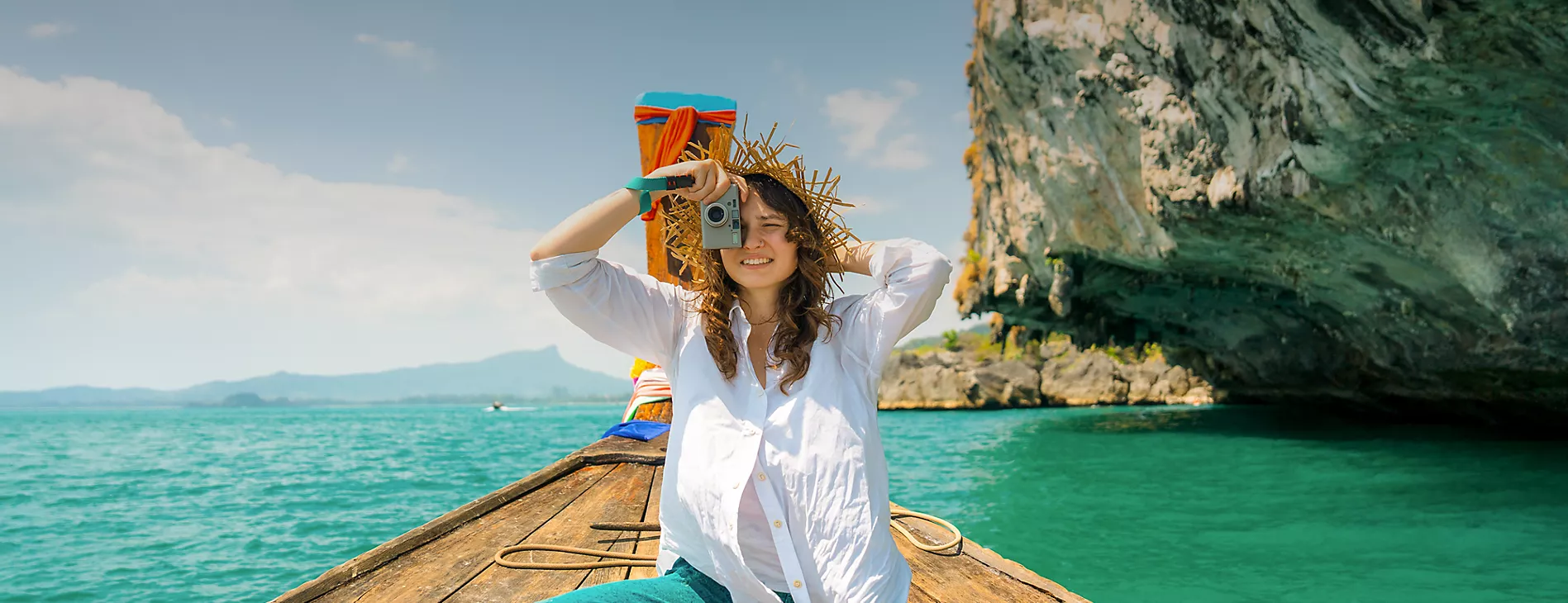 Woman taking photos on a boat trip
